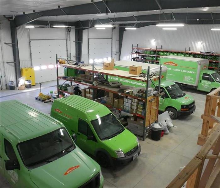 Ottumwa SERVPRO vehicles all lined up in the shop